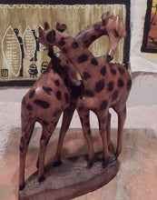 Giraffe lovers handcrafted from Seringa wood