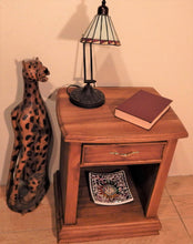 Cheetah wood sculpture at Roots Cabinets & Tile 